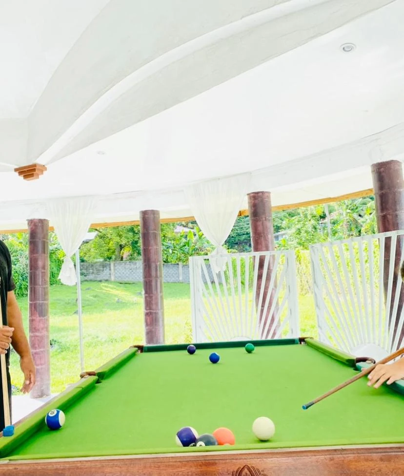 Garden terrace and outdoor seating at Apia Inn